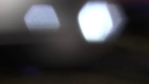 Light moving over two blinking lights blurry background Video stock 75359820