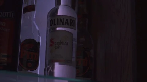 Light moving through whiskey bottles Stock Footage 90123459
