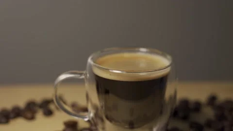 Light moving on transparent cup of espresso Stock Footage 218245614