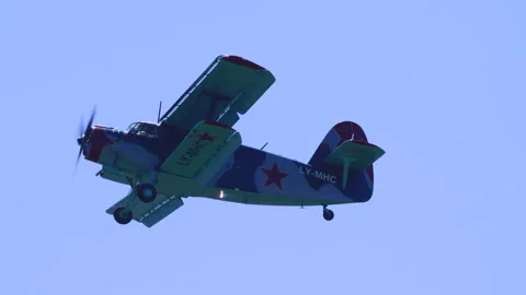 Light Multipurpose Airplane Antonov AN-2 Low Angle Tracking Flypast Alpine Sky Stock Footage 332324669
