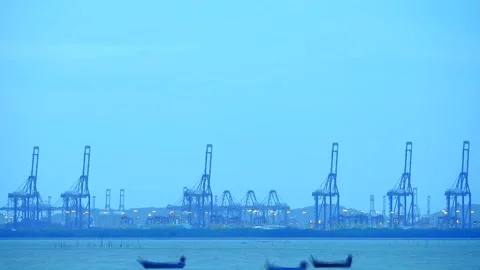 Light night seaport and cranes and machine transport cargo to ship Stock Footage 138734814