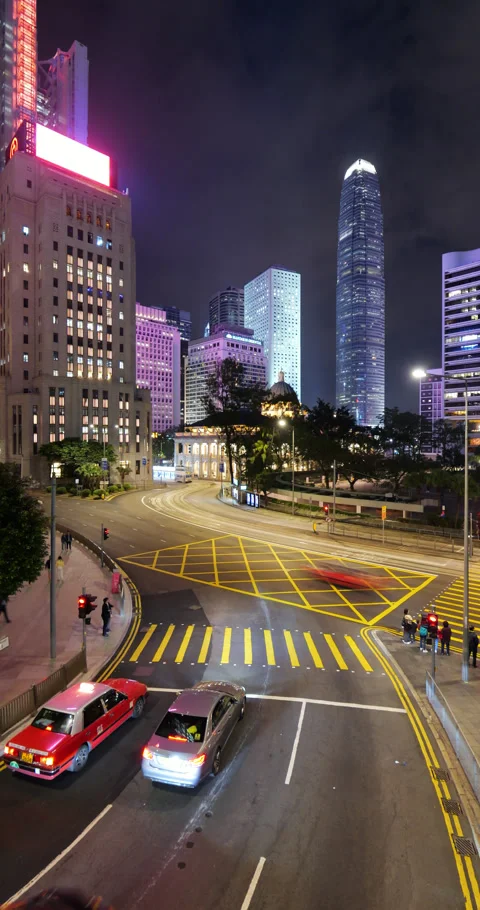 Light night traffic at roads of central Hong Kong with taxis and buses Stock Footage 309402271