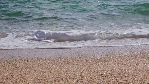 Light ocean wave on a sandy beach close up Stock Footage 102314262