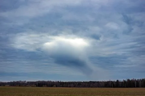 Light but oddly shaped cloud, no rain, spring Stock Photos