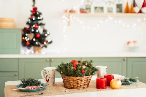 Light Olive Kitchen Decorated for the New Year. Table is festively set for Ch Stock Photos