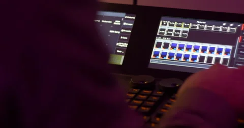 Light operator working with light mixer Stock Footage 58313874