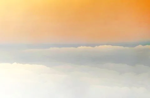 Light orange sky with clouds, can be used as background Stock Photos