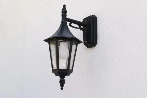 Light outdoor lamp on white Wall Stock Photos