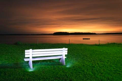 Light painted bench at sunset. Stock Photos