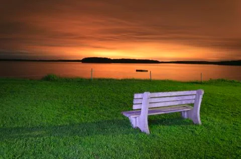 Light painted bench at sunset. Stock Photos