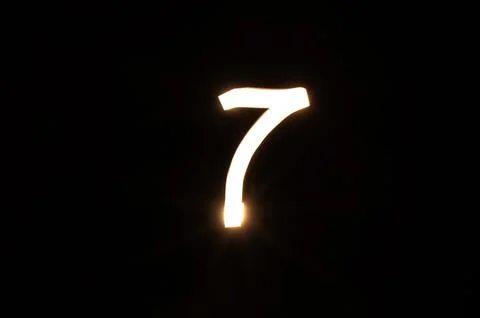 Light Painted Number 7. Symbol of Luck, Magic, and Spiritual Energy Stock Illustration