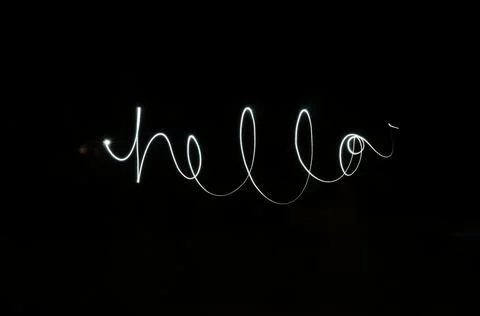 Light Painting Of Word Hello In Cursive Foto stock