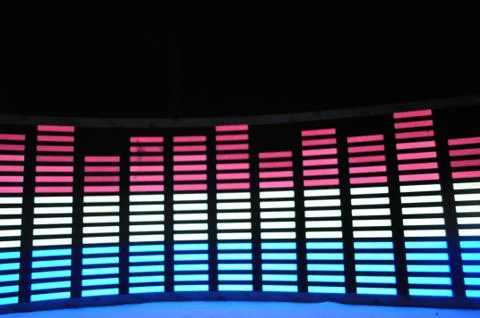 Light panel of pixels, neon with blue or green, yellow and red, bright equalizer Stock Photos