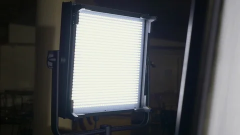 Light panel shines through diffusion on a video production set. Stock Footage 99427452