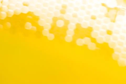 The light passes through the mesh structure, forming blurred hexagonal spots Stock Photos