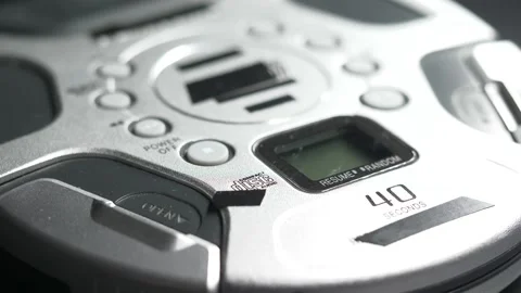 Light Passing Over a Music CD Player Dramatic Closeup Stock Footage 131104764