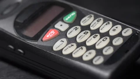 Light Passing Over a Old Cell Phone Unit Tape Dramatic Closeup 스톡 동영상 131104827