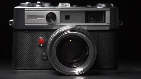 Light Passing Over a Old Vintage Rangefinder Camera Dramatic Closeup Stock Footage 131104559