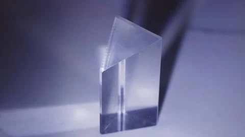 Light Passing Through Triangular Glass Prism. closeup Stock Footage 233425110