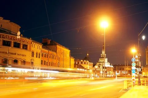 Light paths from headlights on the background of the central part of the city Stock Photos