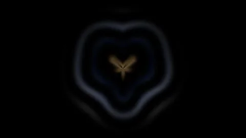 Light pattern forms a heart shape against a dark background Stock Footage 339778579