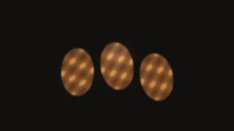 Light patterns appear in a dark space with three glowing Stock Footage 338223790