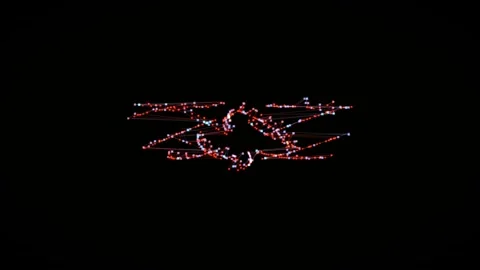 Light patterns create shapes in dark background Stock Footage 340043847
