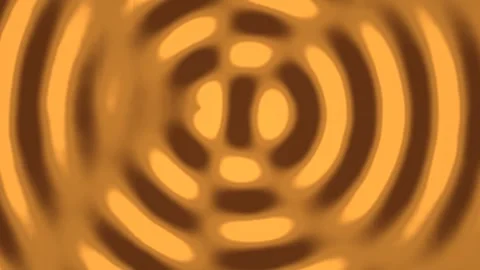 Light patterns create warm circles on a brown background 库存影片 338229245