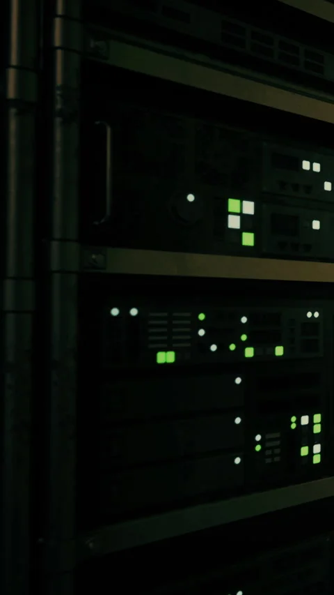 Light patterns dance across server racks in a dimly lit data center Stock Footage 334245965