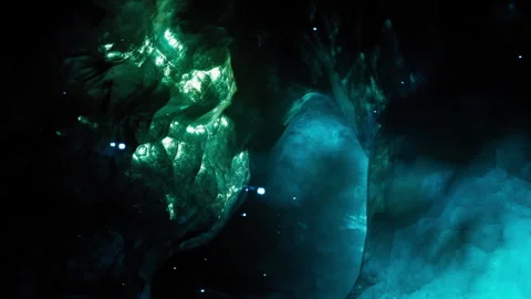Light patterns in a dark cave with glowing elements Stock Footage 344130184