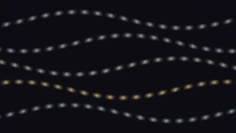 Light patterns flow through dark background in a smooth Stock Footage 338289196