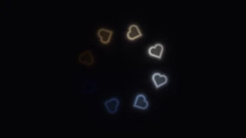 Light patterns form heart shapes in dark background Stock Footage 338224385