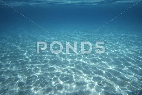 Light patterns on sandy ocean floor, florida keys Stock Photos