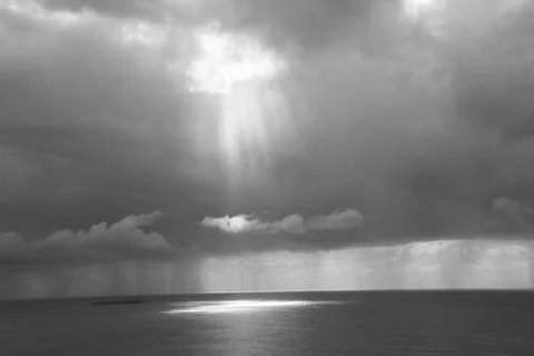 Light Peeping Through a Break in Storm Clouds Stock Photos