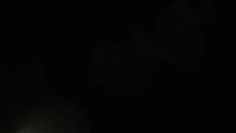 Light permeates the frames on a black background. Studio lens flare. Stock Footage 229655964