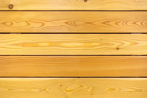 The light pine wall is horizontal. Stock Photos