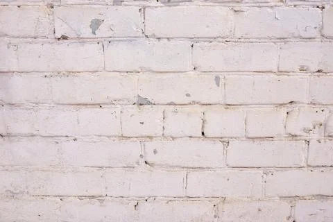 Light pink brick pattern. Old brick wall with cracks and scratches. Brickwall Stock Photos