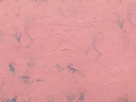 Light pink cement wall with a rough surface.Texture or background Stock Photos