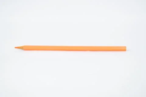 A light pink colored sharp wood pencil crayon isolated on a white background Stock Photos