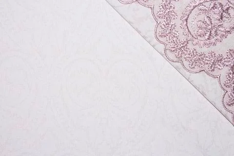 Light pink fabric texture with patterns.Background pink with lace. Stock Photos