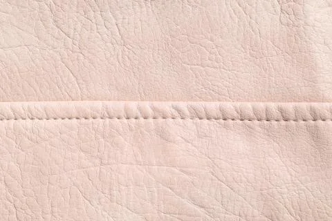 Light pink leather texture with a horizontal seam, natural material backgroun 스톡 사진