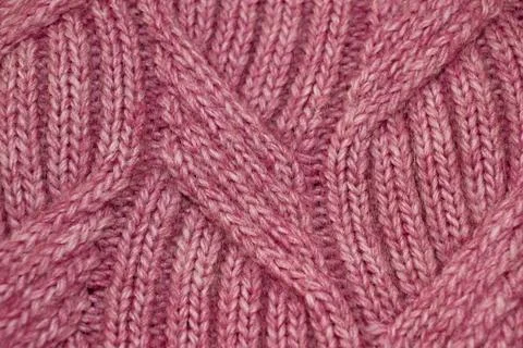 Light pink pattern knitted from wool threads, background texture Foto stock