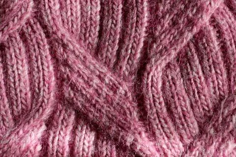 Light pink pattern knitted from wool threads, background texture Stock Photos