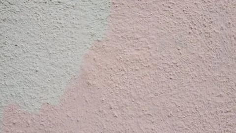 Light pink plaster wall surface closeup. Grunge stucco texture Stock-Fotos