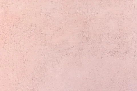 Light pink textured wall surface with subtle patterns 스톡 사진