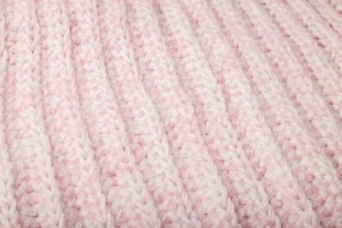 Light pink woolen knitting braid pattern texture, knitted background Stock Photos
