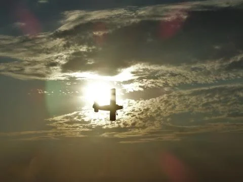 Light plane surrounded by the sun Foto stock