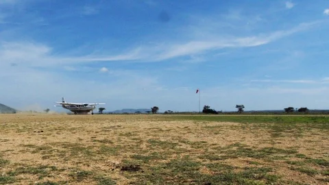 Light plane takes off in the field. Horizontal camera movement. Stock Footage 113731732