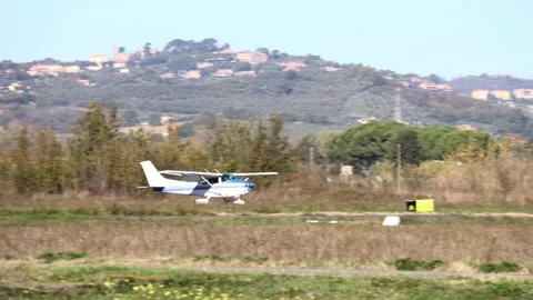 A light plane taxiing on the runway before taking off or after landing Stock Footage 331230161