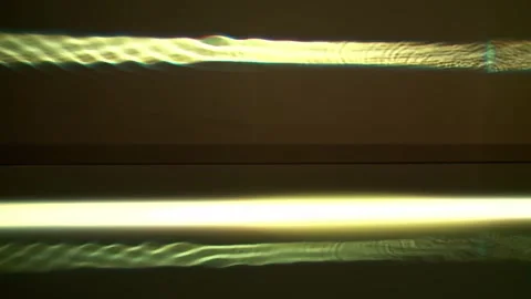 Light play on water. reflection of sound frequency from water to wall. Stock Footage 307920133